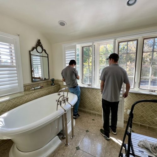 More Options Than Ever For Motorized Blinds - Men installing motorized blinds