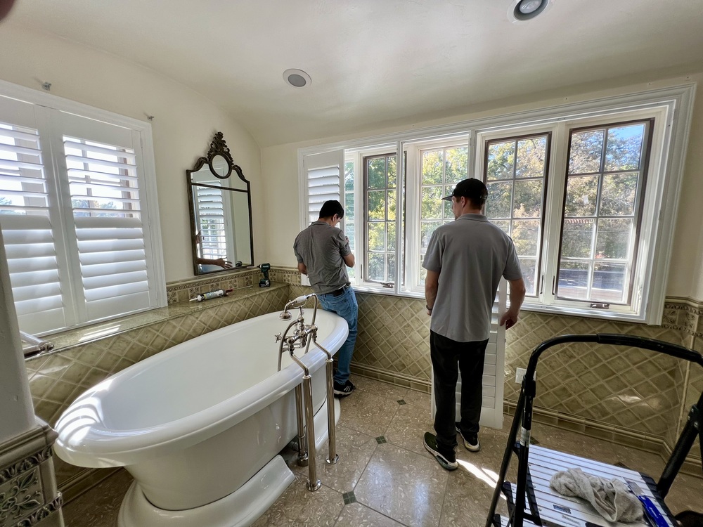 More Options Than Ever For Motorized Blinds - Men installing motorized blinds